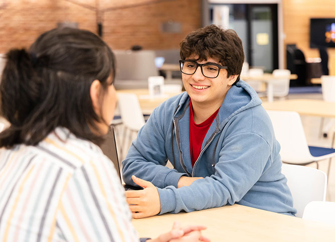 Student meeting with an staff member.